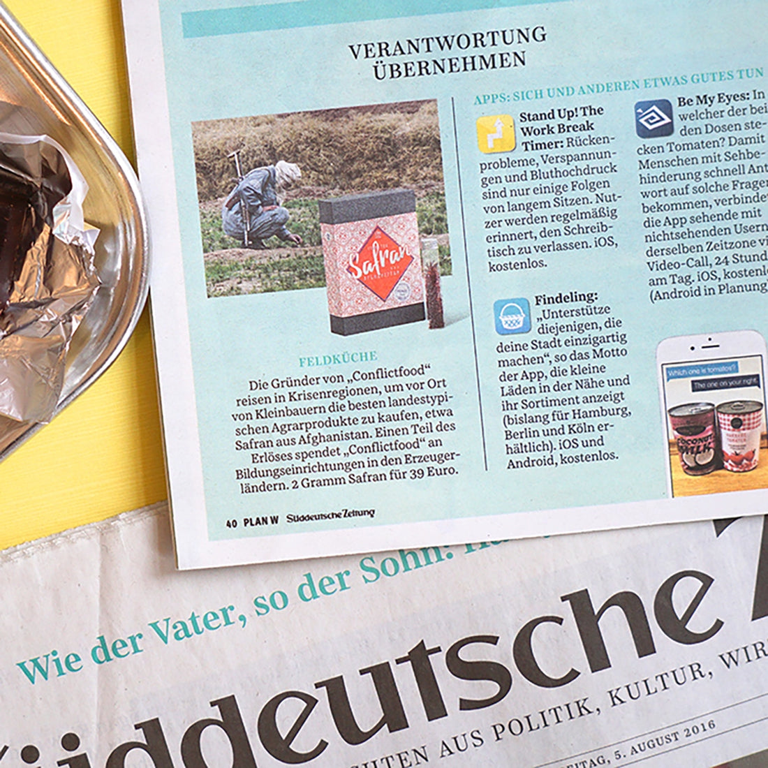 Die Süddeutsche Zeitung liegt aufgeschlagen mit einem Text über Conflictfood